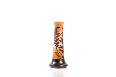 a vase with a design on it sitting on a white surface