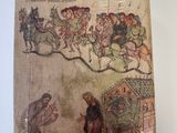 an old book with a picture of a man riding a horse