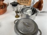 many pots and pans that are sitting on a table