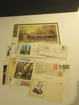 a lot of postcards and stamps on the table