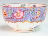 a close up of a bowl with flowers on it