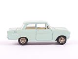 a toy car that is sitting on a white surface