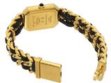 a close up of a gold and black bracelet with a gold clasp