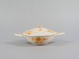 an image of a white and orange bowl with a lid