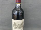 a bottle of wine that is sitting on a table