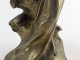an image of a statue of a woman with a bird on her shoulder