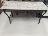 a table with a marble top in a store