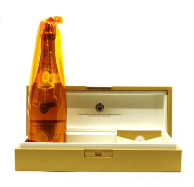 a bottle of champagne sitting in a box next to a bottle of wine