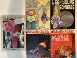 plusieurs livres pour enfants sont alignés sur une surface blanche