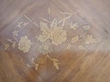 an image of a wooden table with a floral design on it