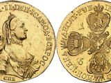 an image of a gold coin with the image of a woman holding a baby