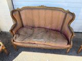 a couch that is sitting in front of a garage door