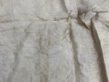 a close up of a piece of fabric with a knot