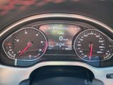 a close up of a car dashboard with various gauges