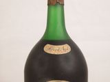a bottle of wine that is sitting on a table