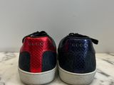 a close up of a pair of sneakers on a marble surface