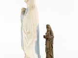 statue of the virgin mary and child jesus with a statue of jesus in the foreground