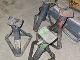 a pile of tools sitting on the floor in a room