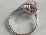 a silver ring with a flower on it