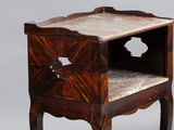 a small wooden table with a marble top on it