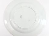 a white plate with a black and white design on it