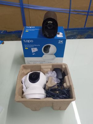 a box with a camera inside of it on a table