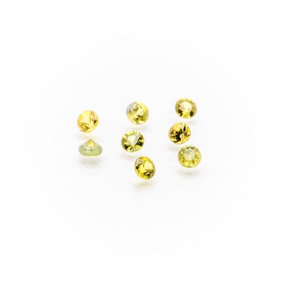 a group of yellow sapphires on a white background