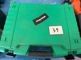 a green box with a number on it sitting on a table