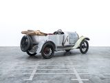 a silver car that is parked in a parking lot