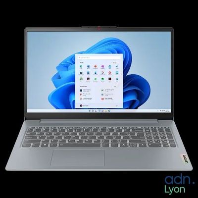 l'ordinateur portable est ouvert sur un fond noir avec un fond bleu