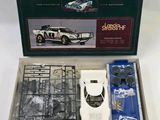 a box with a model of a car in it