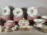 many plates and cups and saucers that are on the table