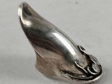 a close up of a silver object on a table