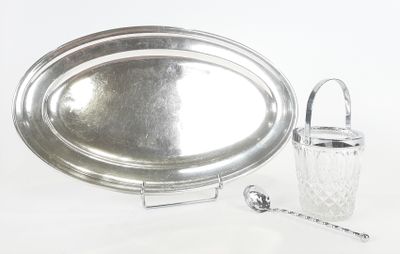 a silver tray with a silver handle and a glass container