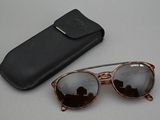 a pair of sunglasses and a case on a table