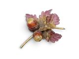 an image of a close up of a flower brooch on a white surface