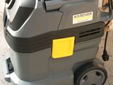 a close up of a vacuum cleaner on a cart in a room