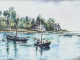 two boats that are floating in the water near a house