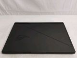 the laptop is sitting on a white surface with a white background
