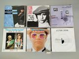 a lot of cds that are on the table