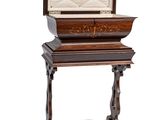 a small wooden table with a box on top of it