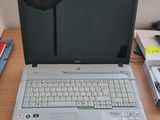 a laptop computer sitting on top of a wooden desk