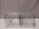 two clear plastic containers with lids on a white table