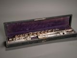 a flute that is in a case on a table