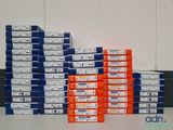 many boxes of cigarettes stacked on top of each other