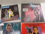 a lot of vinyl records on the table