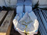 several pieces of luggage sitting on top of a pile of wood