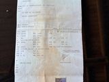 receipt sitting on top of a table with a stamp on it
