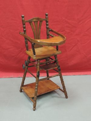 wooden high chair with wooden seat and wooden shelf on grey floor
