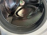 a close up view of a washing machine with the door open